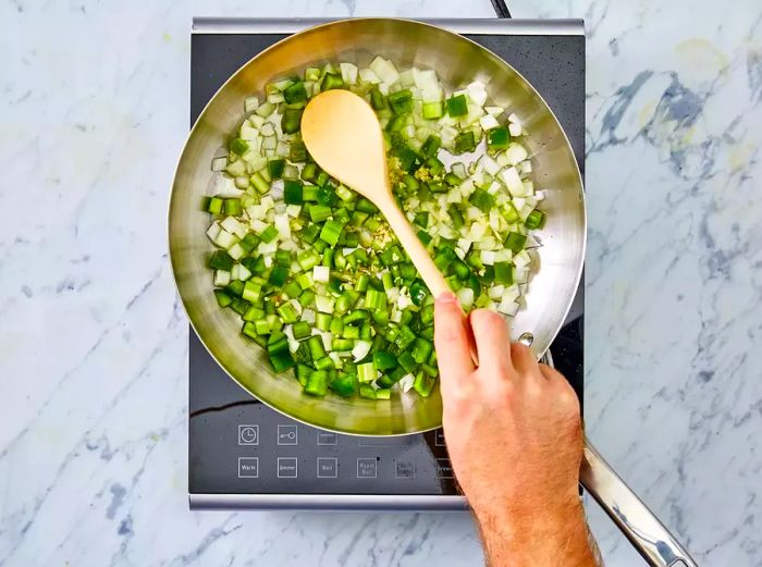 Onions, celery, green pepper, and garlic sautéing in olive oil.