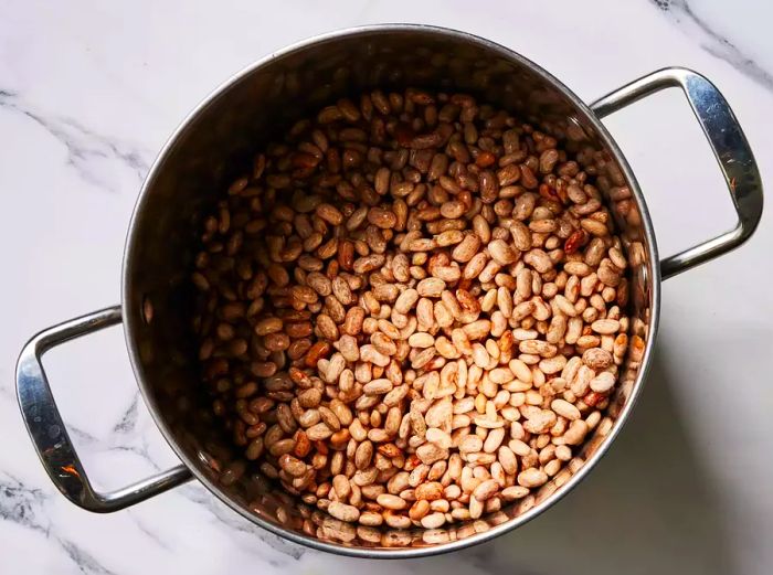 A large pot filled with pinto beans