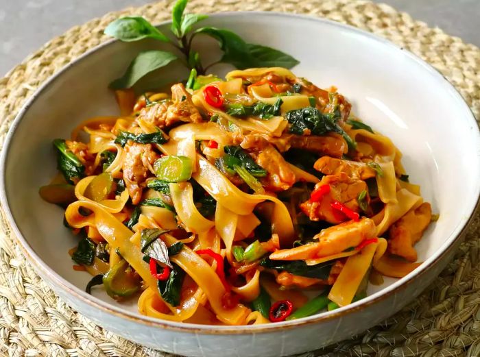 A close-up view of a bowl of Drunken Noodles.