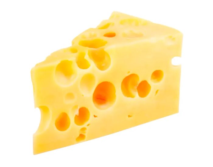 A chunk of Swiss cheese isolated on a white background.