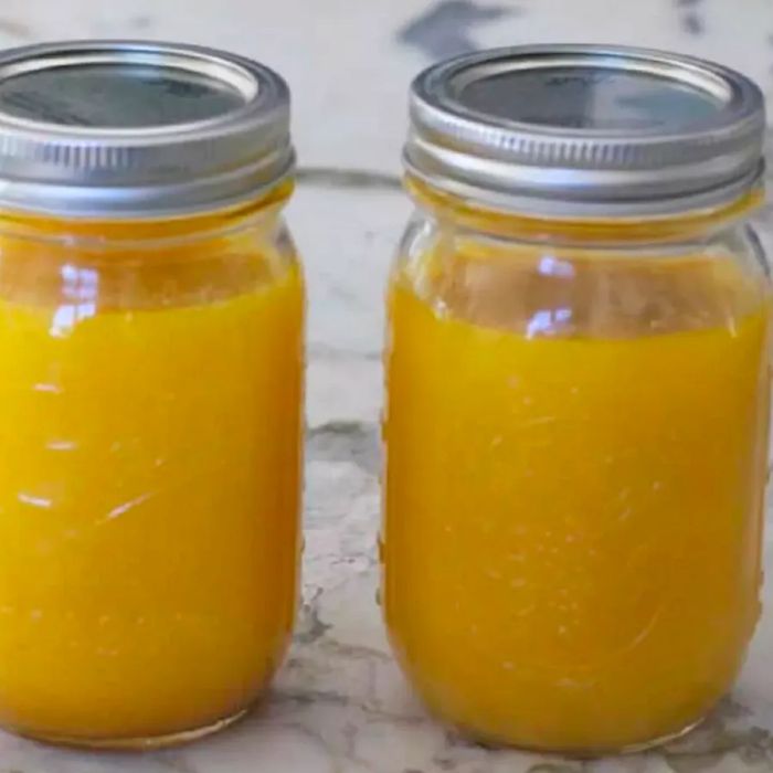 Two sealed mason jars of homemade Instant Pot ghee