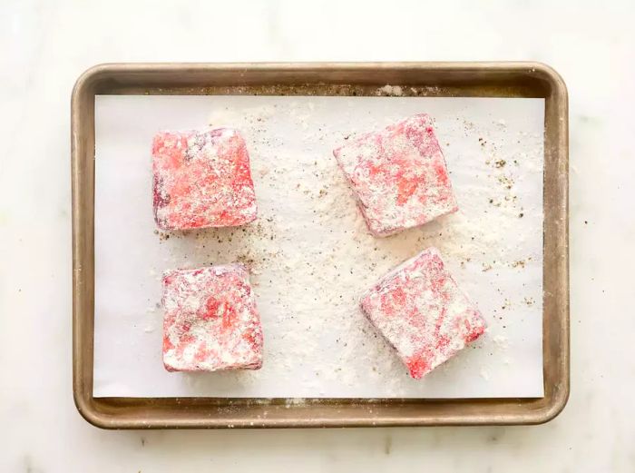 Short ribs seasoned and coated in flour.