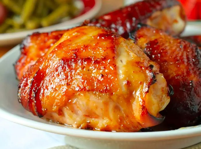 close-up of succulent grilled chicken thighs with a perfectly glossy, browned skin