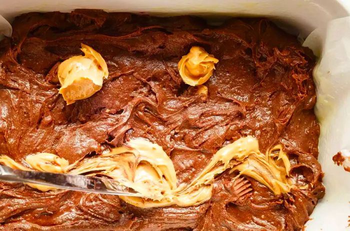 swirling peanut butter into brownie batter