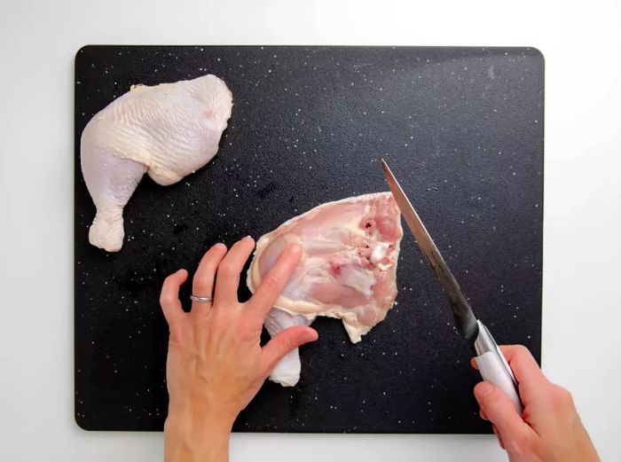 Cutting a whole chicken into sections