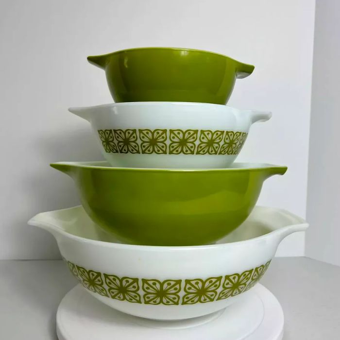 Vintage white and olive mixing bowls with playful square motifs and distinctive handles