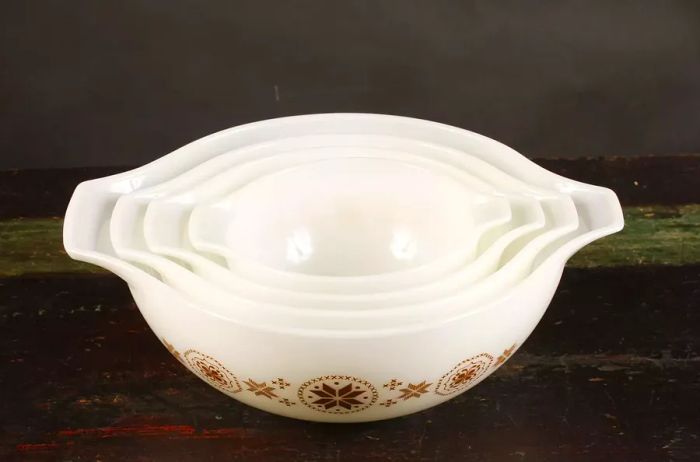 Vintage white glass bowls featuring a brown stitch-like starburst pattern