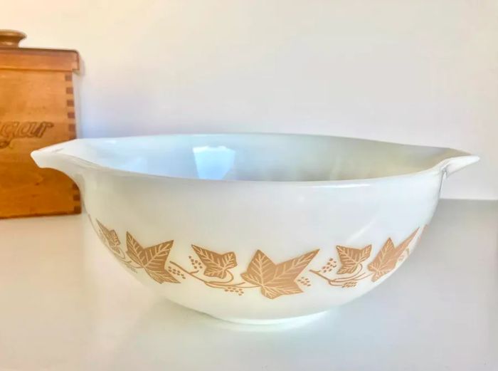 White vintage bowl featuring a leaf pattern