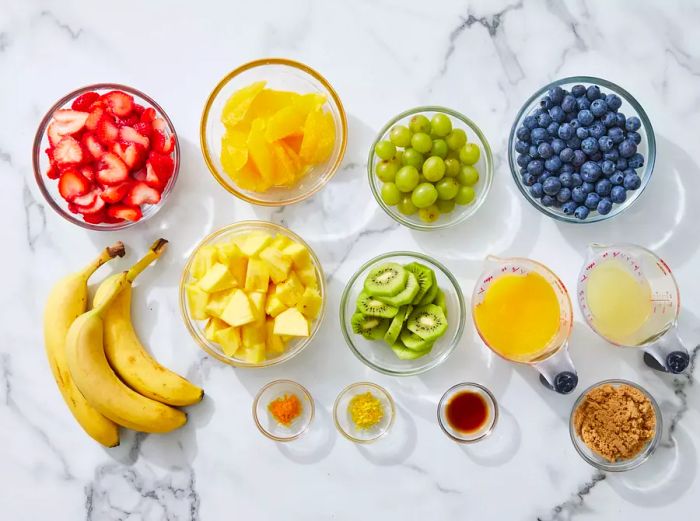 Fresh Summer Fruit Salad Ingredients on a Sleek Marble Counter