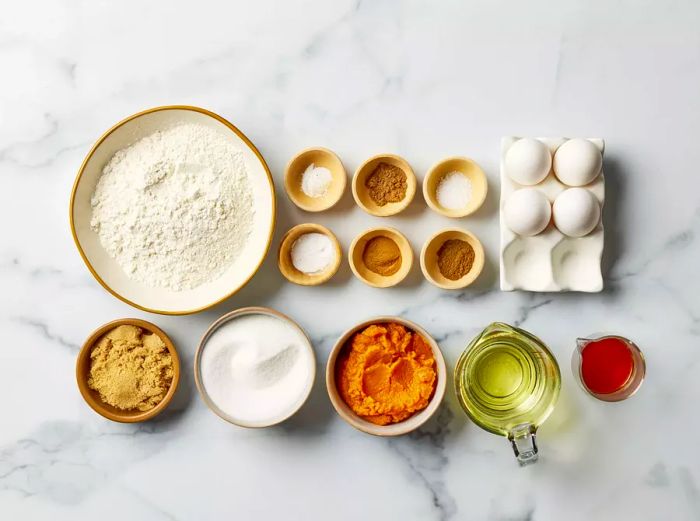 Bowls filled with ingredients ready to make homemade Starbucks pumpkin bread.