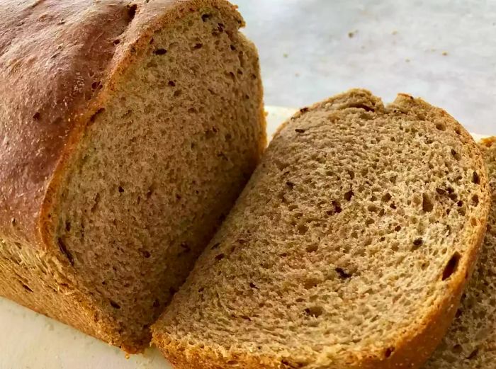 A close-up shot of sliced rye bread