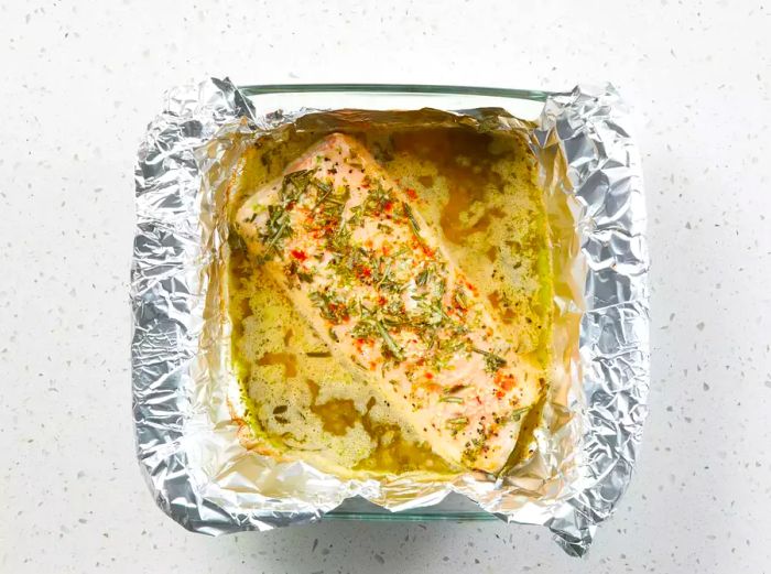 The fish is baked to perfection, flaking easily and with a golden, browned top.