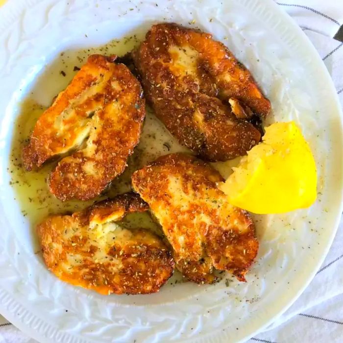 Pan-fried halloumi garnished with lemon juice and oregano