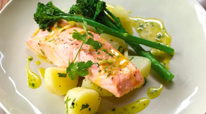 citrus-glazed salmon served with potatoes and vegetables