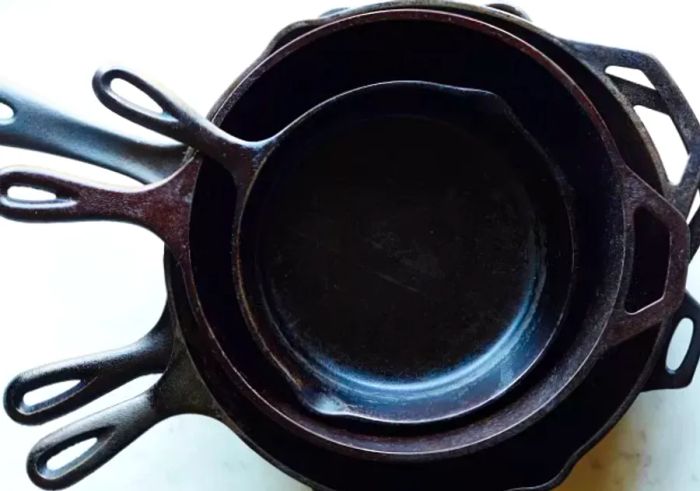 Collection of Well-Seasoned Cast Iron Skillets