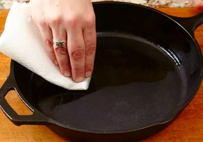 Applying Oil to a Clean Cast Iron Skillet