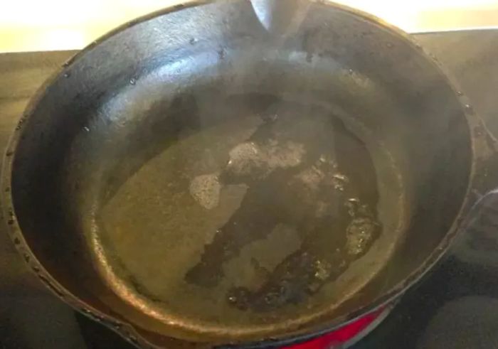 Place the pan on the stove to dry it thoroughly.