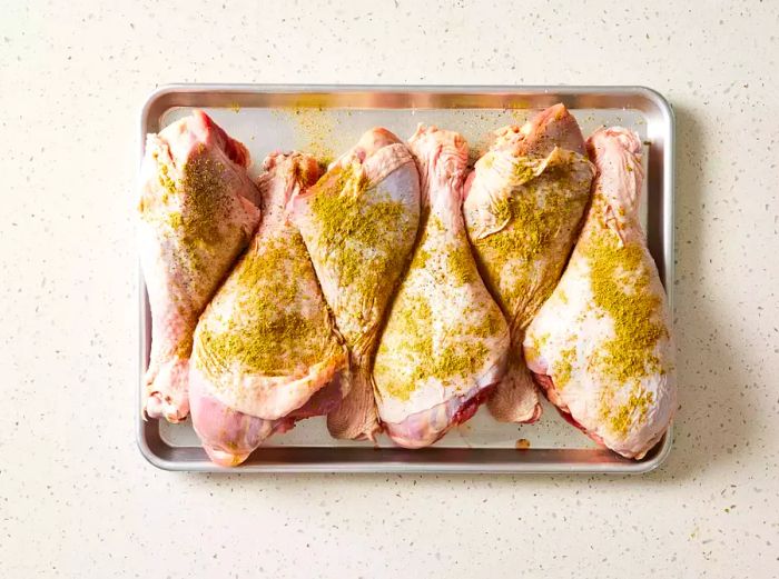 Seasoned Turkey Legs on a Baking Sheet