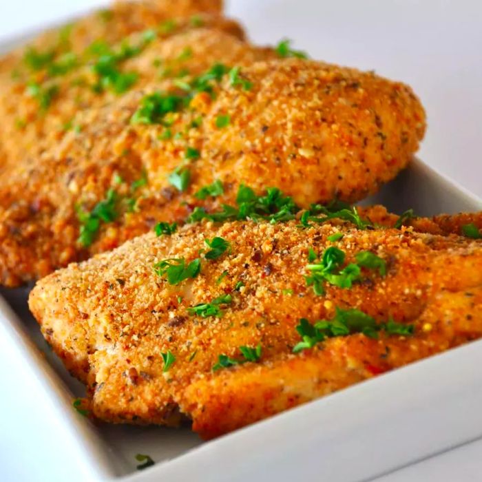 Baked Garlic Parmesan Chicken served on a white plate