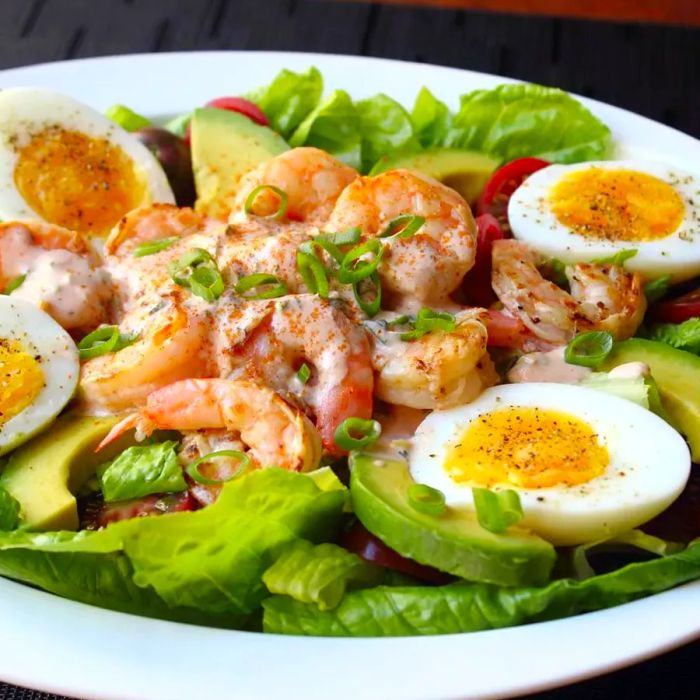 Salad with shrimp, hard-boiled eggs, and avocado slices