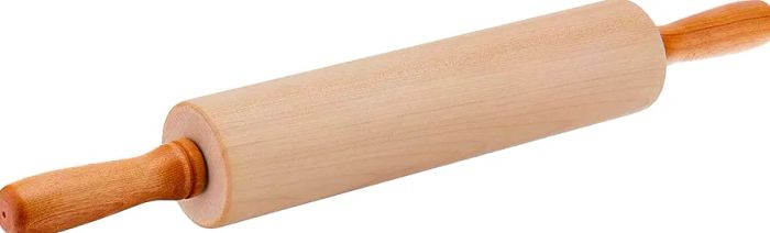 Wooden handled rolling pin on a white surface