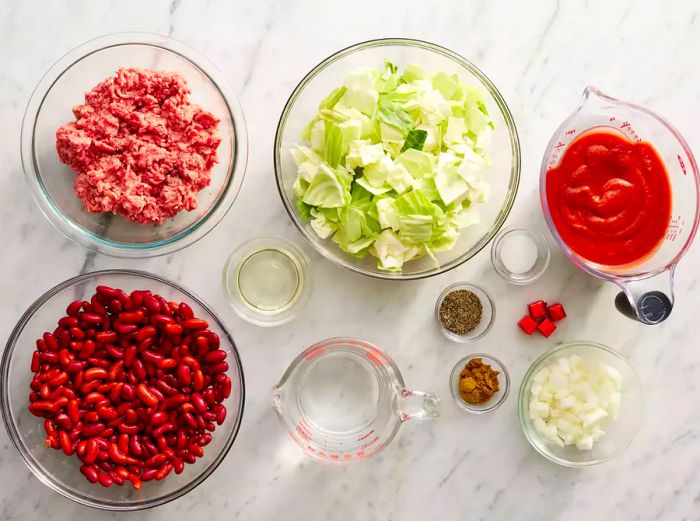 All the ingredients are prepared for making the beef and cabbage soup.