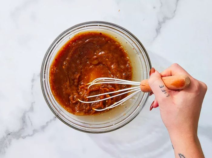 Stir-fry sauce mixed together in a glass bowl.