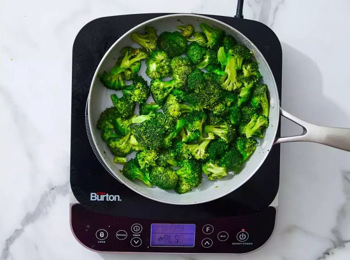 Broccoli added to the skillet, cooked until vibrant green and thoroughly heated.