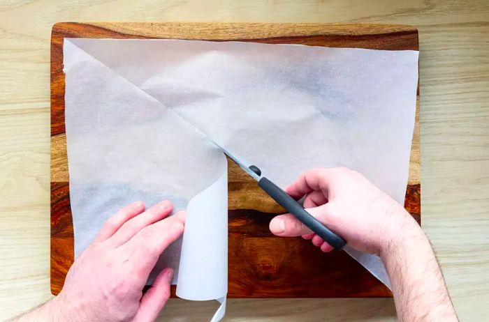 Cutting a rectangular parchment paper into two triangles