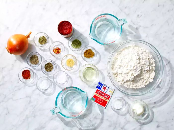 All ingredients ready to make homemade pizza.