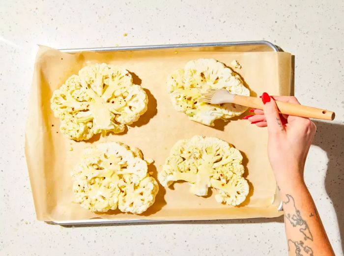 Cauliflower tops coated with olive oil mixture