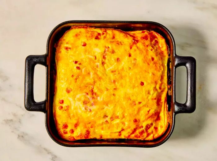 An overhead shot of a perfectly baked omelet fresh out of the oven.