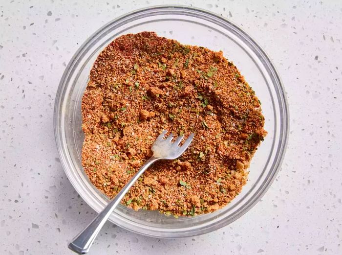 All the seasoning ingredients blended together in a bowl.