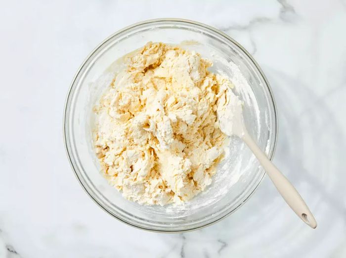 Dough being mixed in a bowl