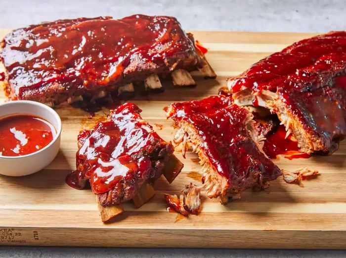 Saucy Instant Pot ribs served on a cutting board.