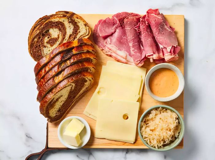 A collection of ingredients neatly arranged on a cutting board.