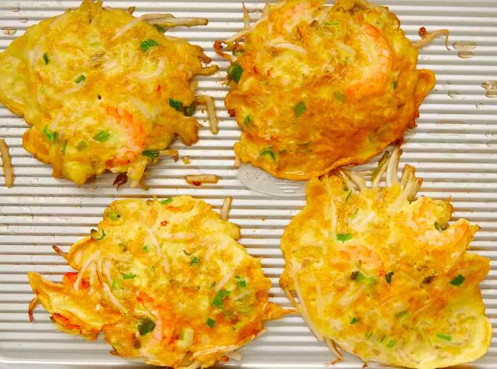 High-angle shot of freshly cooked shrimp egg foo young patties