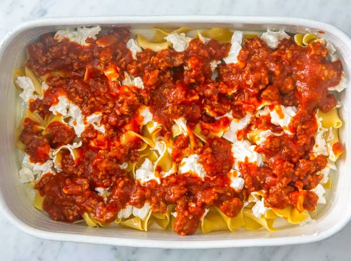 All ingredients layered in the prepared baking dish, ready for baking.