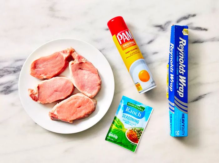 All ingredients are ready to prepare the air fryer ranch pork chops.