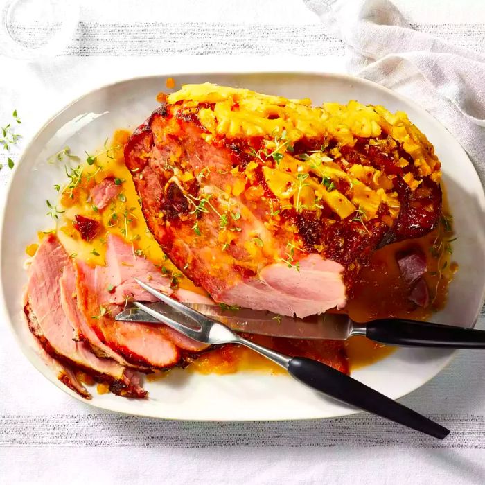 An overhead shot of Bourbon-Glazed Ham served on a platter.