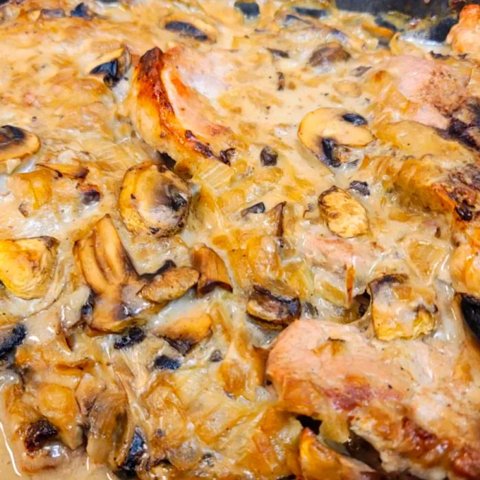 Close-up shot of the Mushroom Sauce Baked Pork Chops in the baking dish