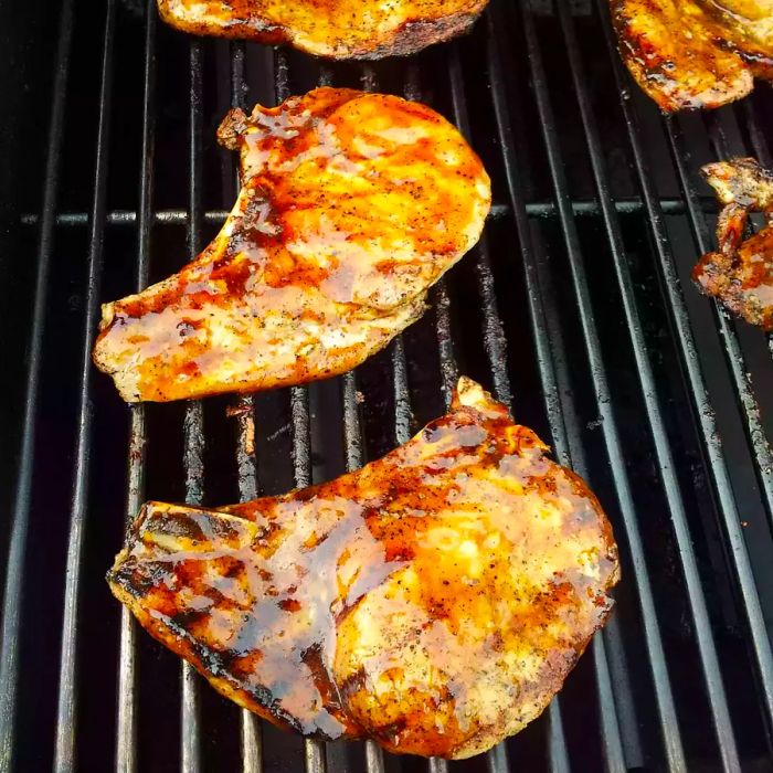 Close-up shot of Grilled Brown Sugar Pork Chops on the barbecue