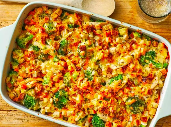 A bird's-eye view of a delicious broccoli chicken casserole in a 9x13-inch baking dish.