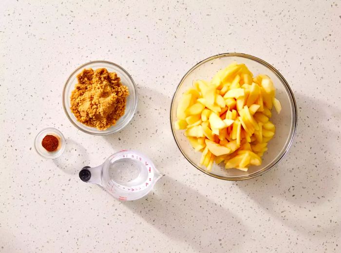 Ingredients for making a spiced slow cooker applesauce