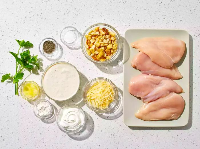 All the ingredients are ready to make your delicious baked Caesar chicken.