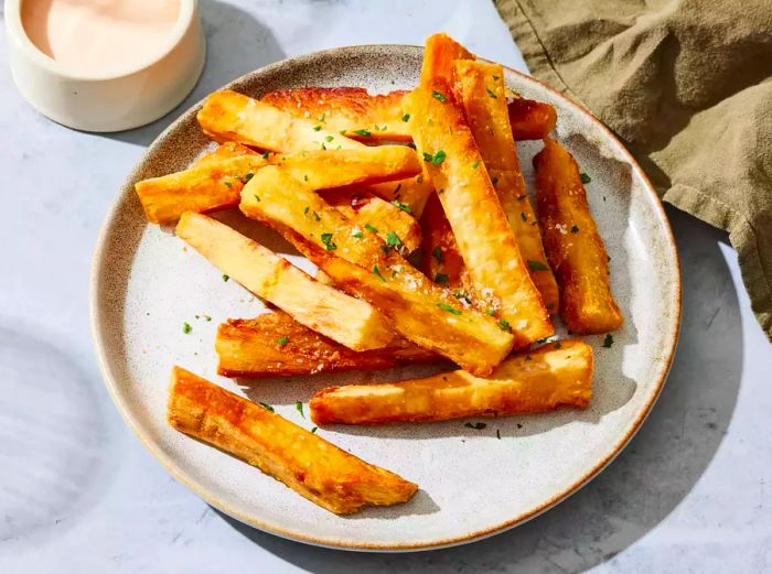 yuca fries sprinkled with salt, ready to serve