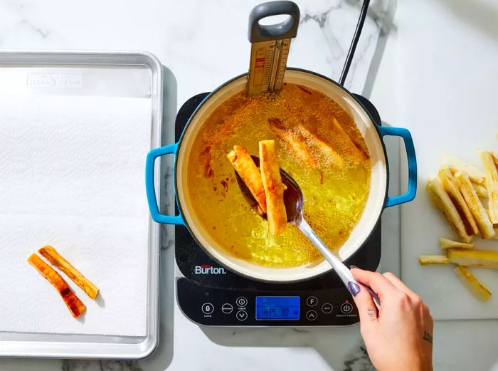 Frying yuca in small batches