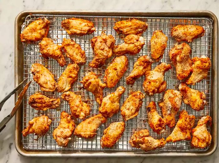 Golden, crispy wings freshly pulled from the oven.