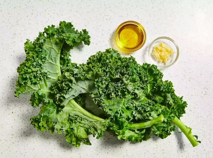 A top-down view of the ingredients ready for making garlic kale.