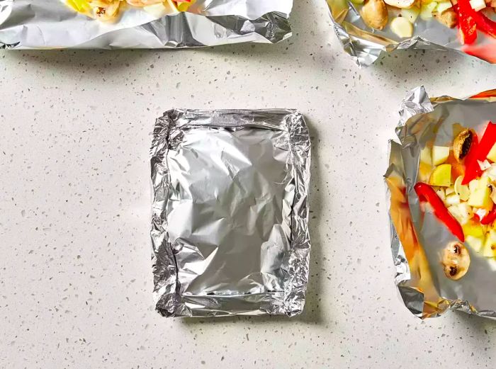 Cover each portion with an extra layer of foil and secure the edges tightly.